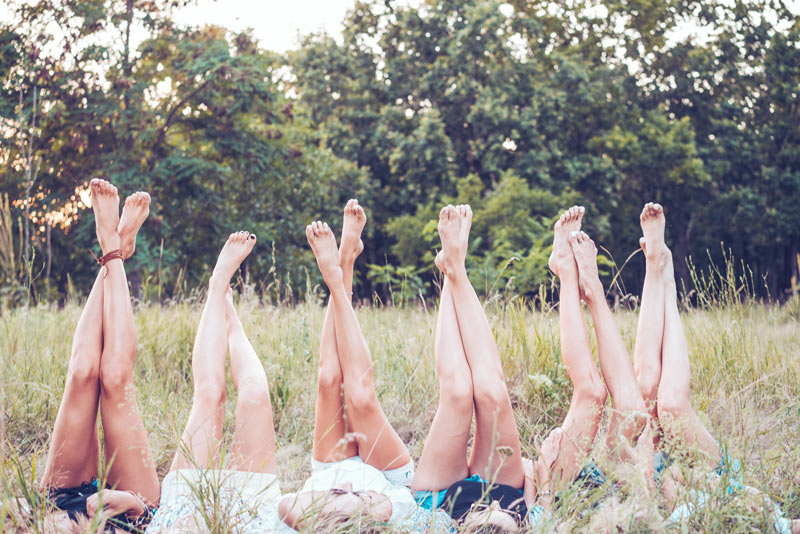 Girls lying on grass at a party